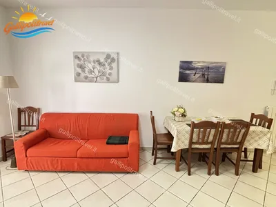 Zona giorno tavolo pranzo divano, trilocale B2/3 al Residence Rosa Virginia, Gallipoli