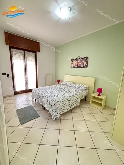 Camera principale verde balcone, trilocale B2/4 al Residence Rosa Virginia, Gallipoli
