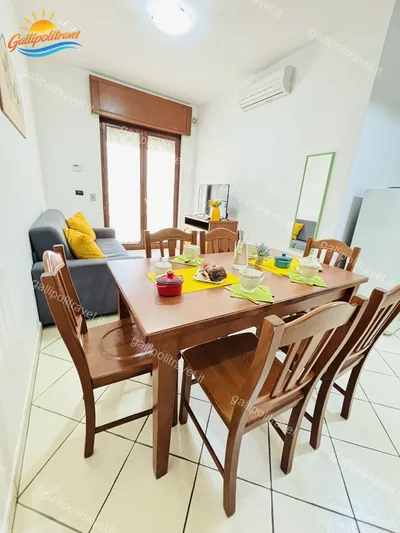 Zona pranzo divano cuscini, trilocale B2/4 al Residence Rosa Virginia, Gallipoli